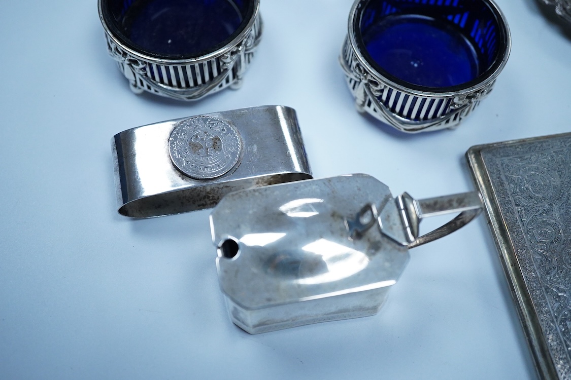 A small group of silver to include an Elizabeth II pierced shallow dish by Viners Ltd, Sheffield, 1957, diameter 12.4cm, a 1930's silver mounted cigarette box, a George III silver fiddle pattern sauce ladle and five silv